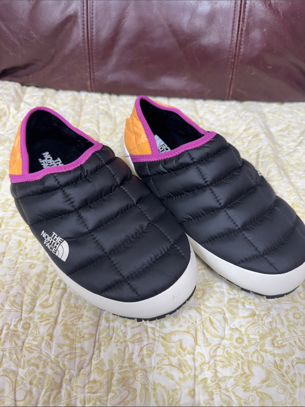 The North Face Slip-On Quilted Slippers in Black with Pink & Orange Trim
